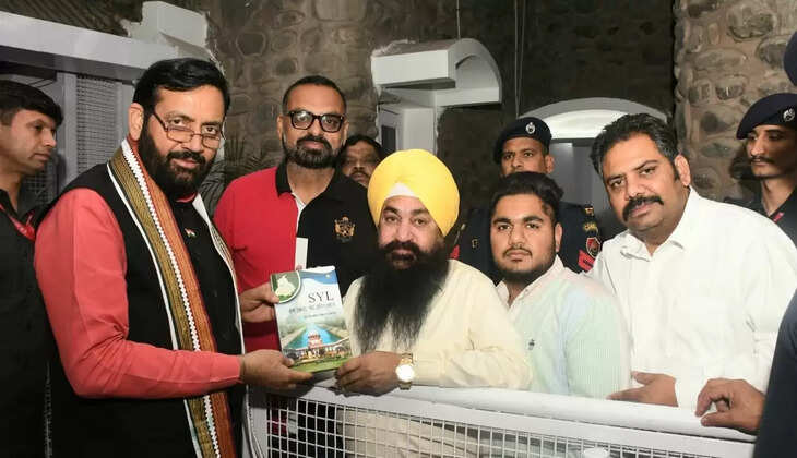 Senior Haryana journalist Advocate Baljit Singh presented a book written on SYL to Chief Minister Naib Singh Saini